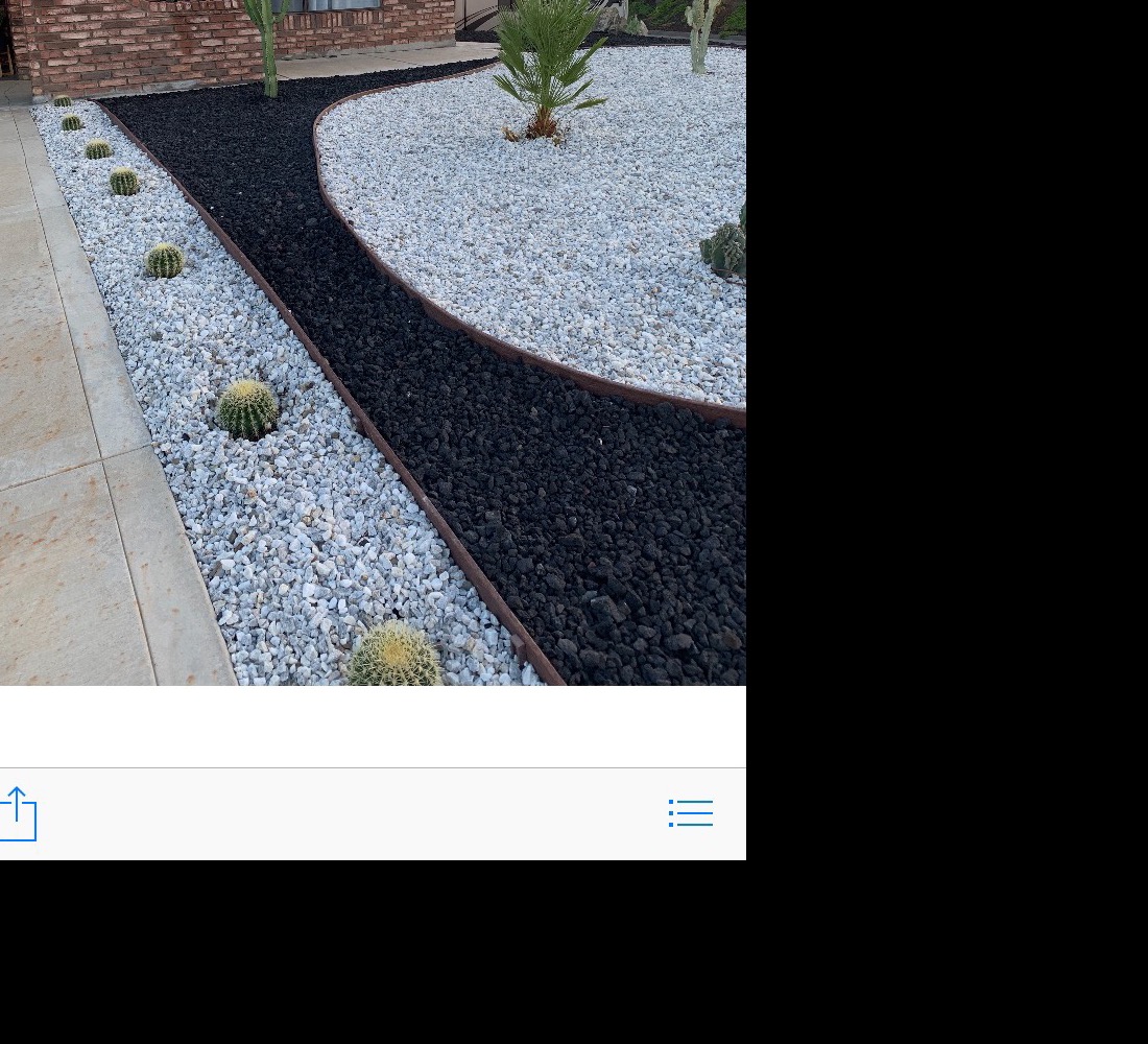 Desert front yard with black and white decorative rock and cacti in San Jacinto, CA