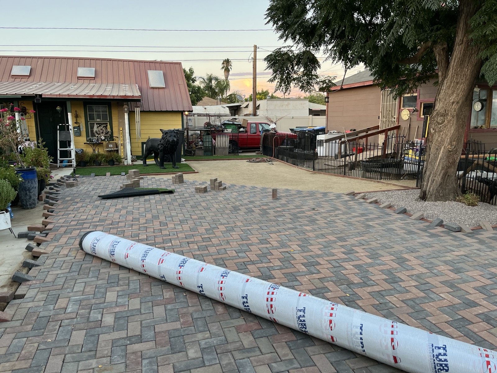 Herringbone paver installation in progress showing craftsmanship